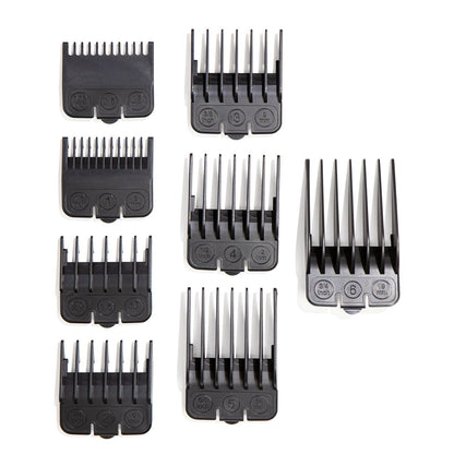 Set of black hair clipper attachments on a white background