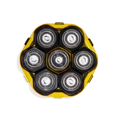 Yellow and black electric shaver head on a white background