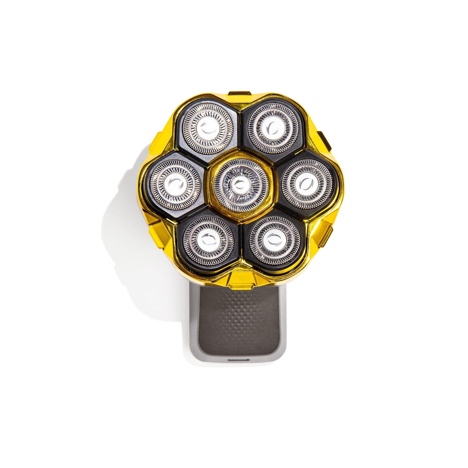 Shaver head with multiple circular components on a white background