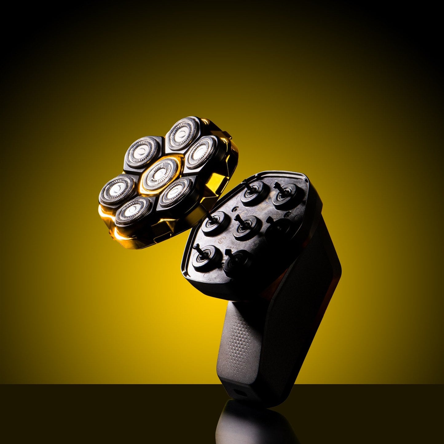 Electric shaver with head and handle on a yellow background