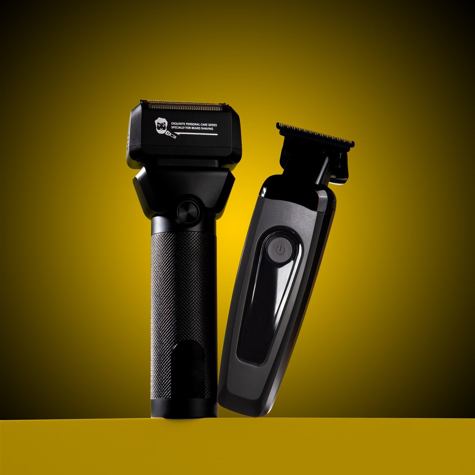 Two black grooming tools on a yellow background