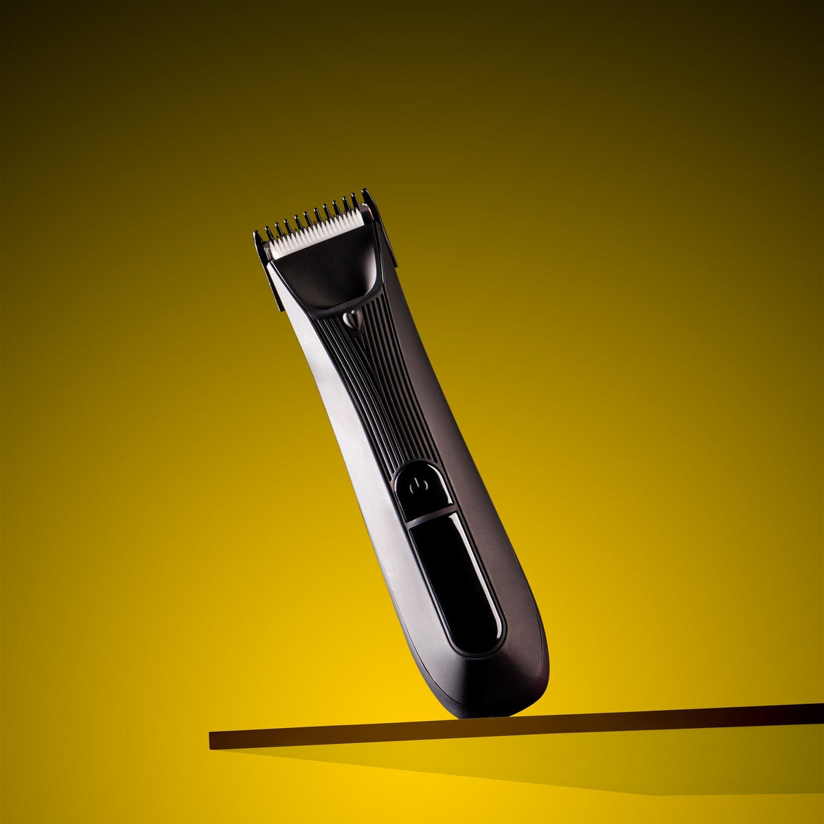 Hair trimmer on a yellow background