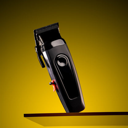 Black hair clipper on a yellow background