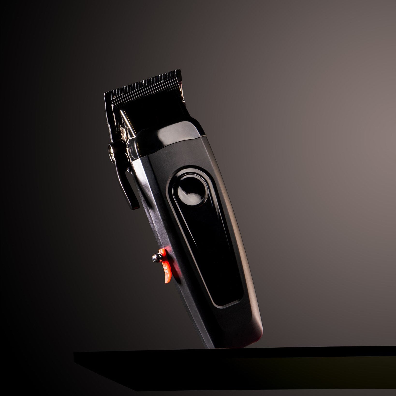 Black hair clipper on a dark background