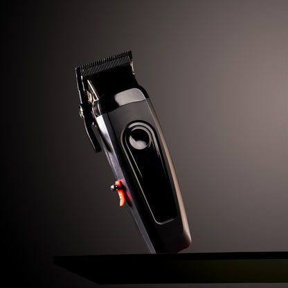 Black hair clipper on a dark background