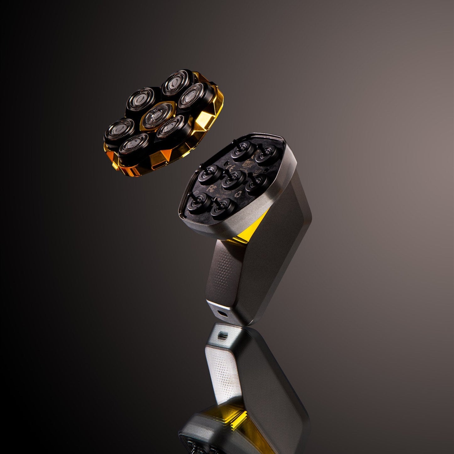 Shaver head with multiple blades on a dark background