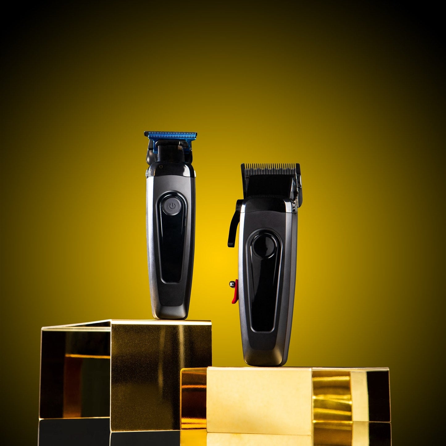Two hair trimmers on reflective gold and silver blocks with a gradient yellow to black background