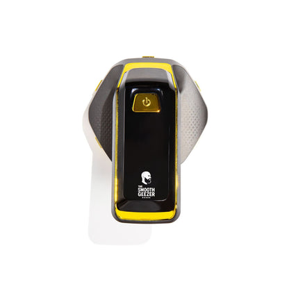 Black electronic head shaver with yellow accents on a white background