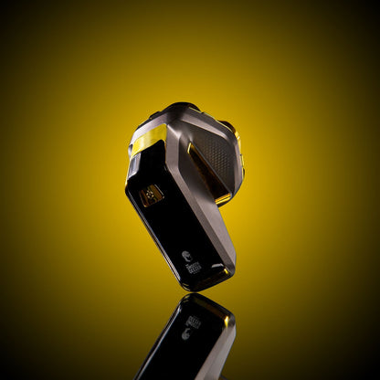 Black and yellow device on a reflective surface with a gradient yellow background